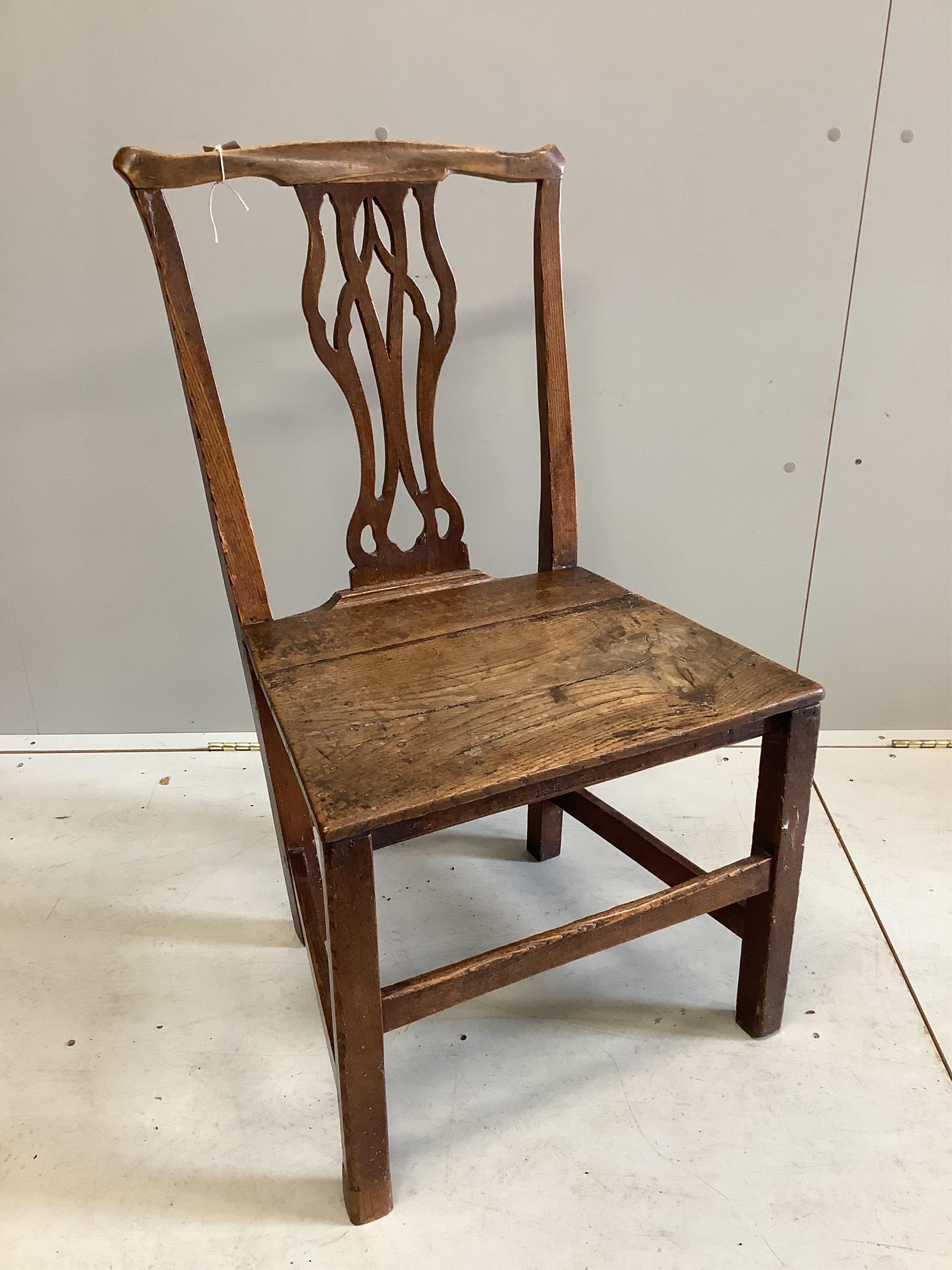 An 18th century circular oak and pine cricket table, diameter 57cm, height 63cm, together with an 18th century oak and fruitwood dining chair. Condition - poor to fair